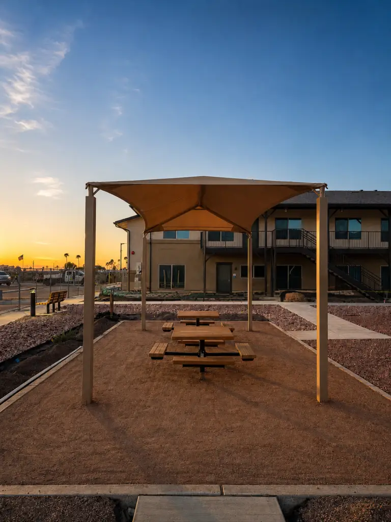 Outdoor shade pavilion with picnic tables built by SK Fencing in Somerton, Arizona